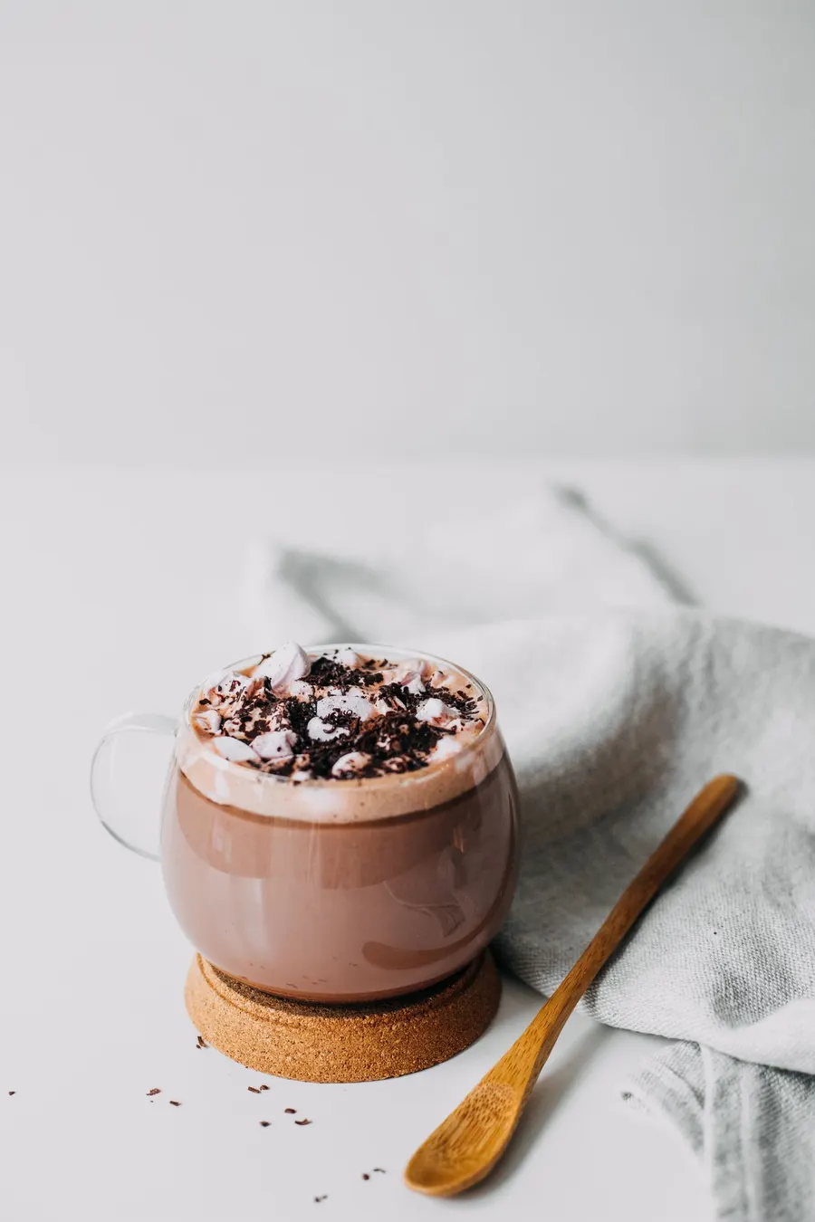 Hot chocolate with marshmallows in a clear glass cup