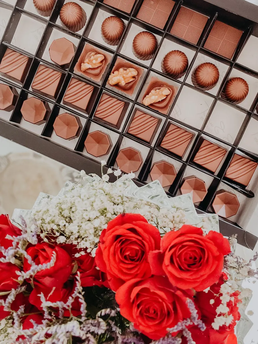 Bouquet of flowers and a box of chocolate