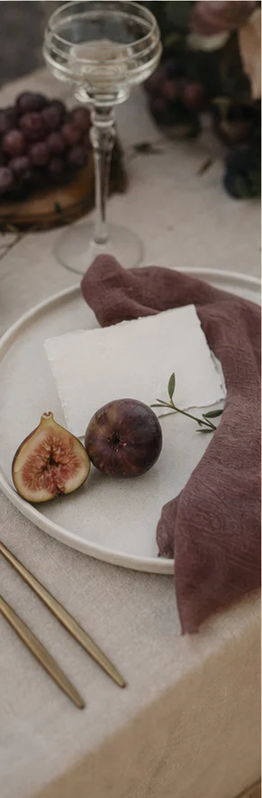 Illustrative place setting with figs and linen
