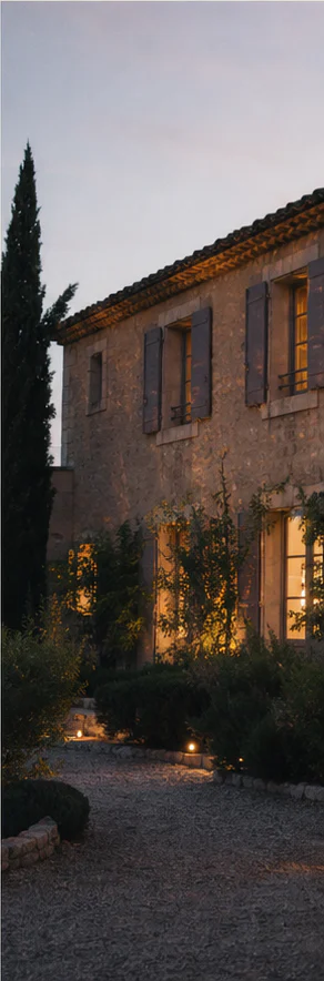 Illustrative ochre-stone bastide at dusk