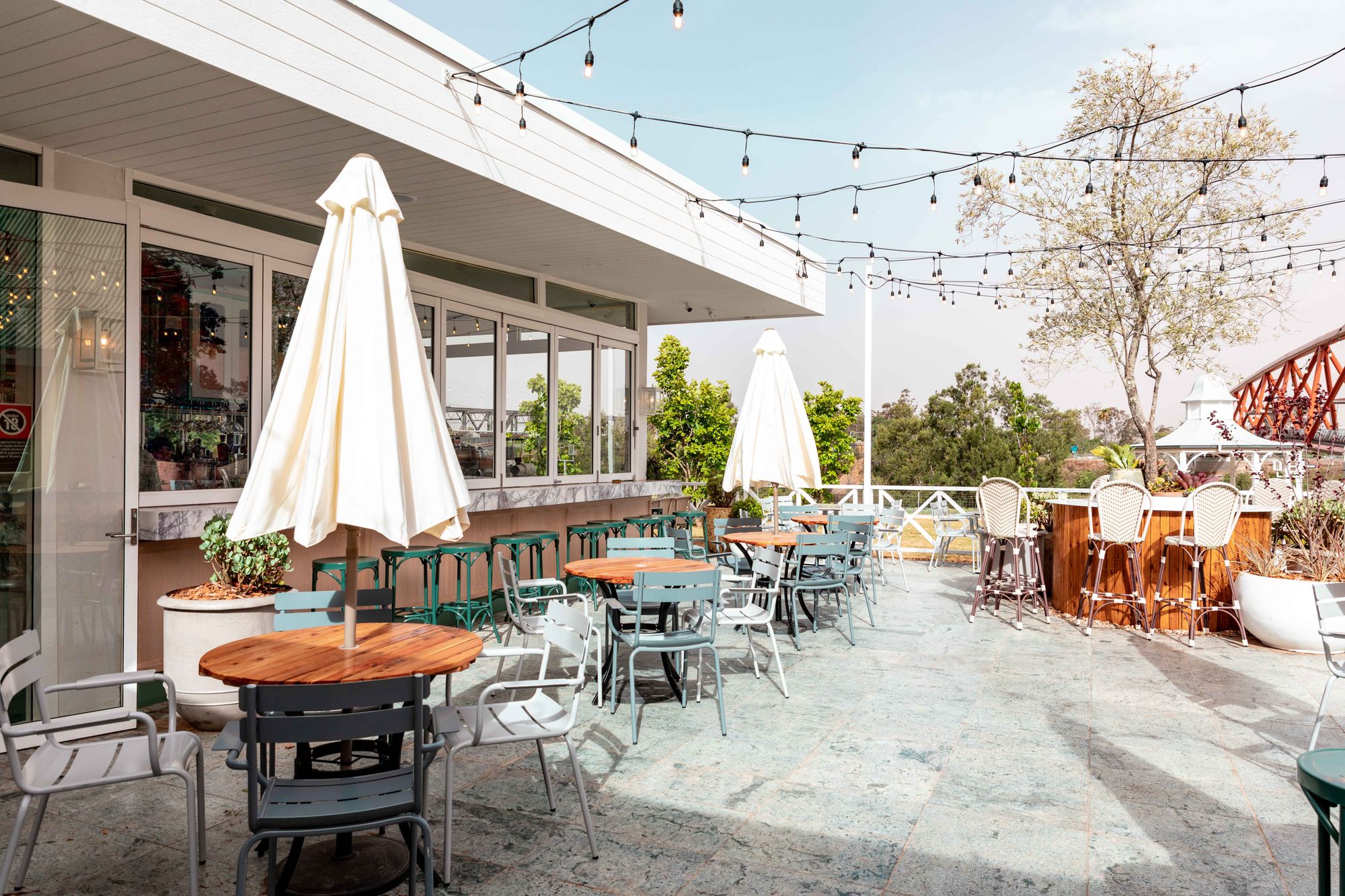Bright garden terrace with simple dining tables
