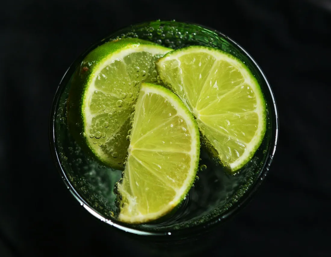 Overhead view of lime slices in a glass