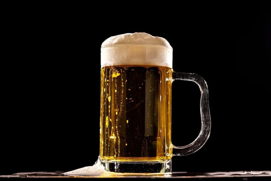 A mug of hazy amber beer