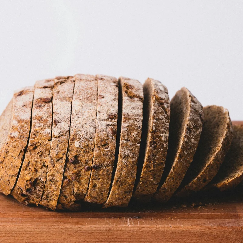 Artisanal crusty sourdough loaf with flour-dusted scored crust
