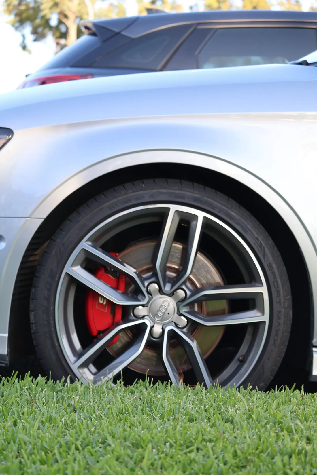 Luxury silver alloy wheel with red brake calipers