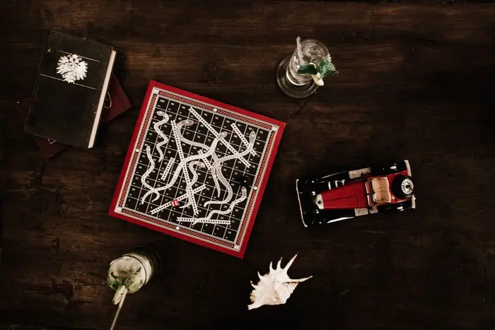 Playing cards on a wooden table with drinks