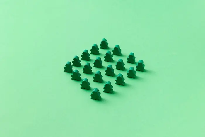 Green meeple game pieces