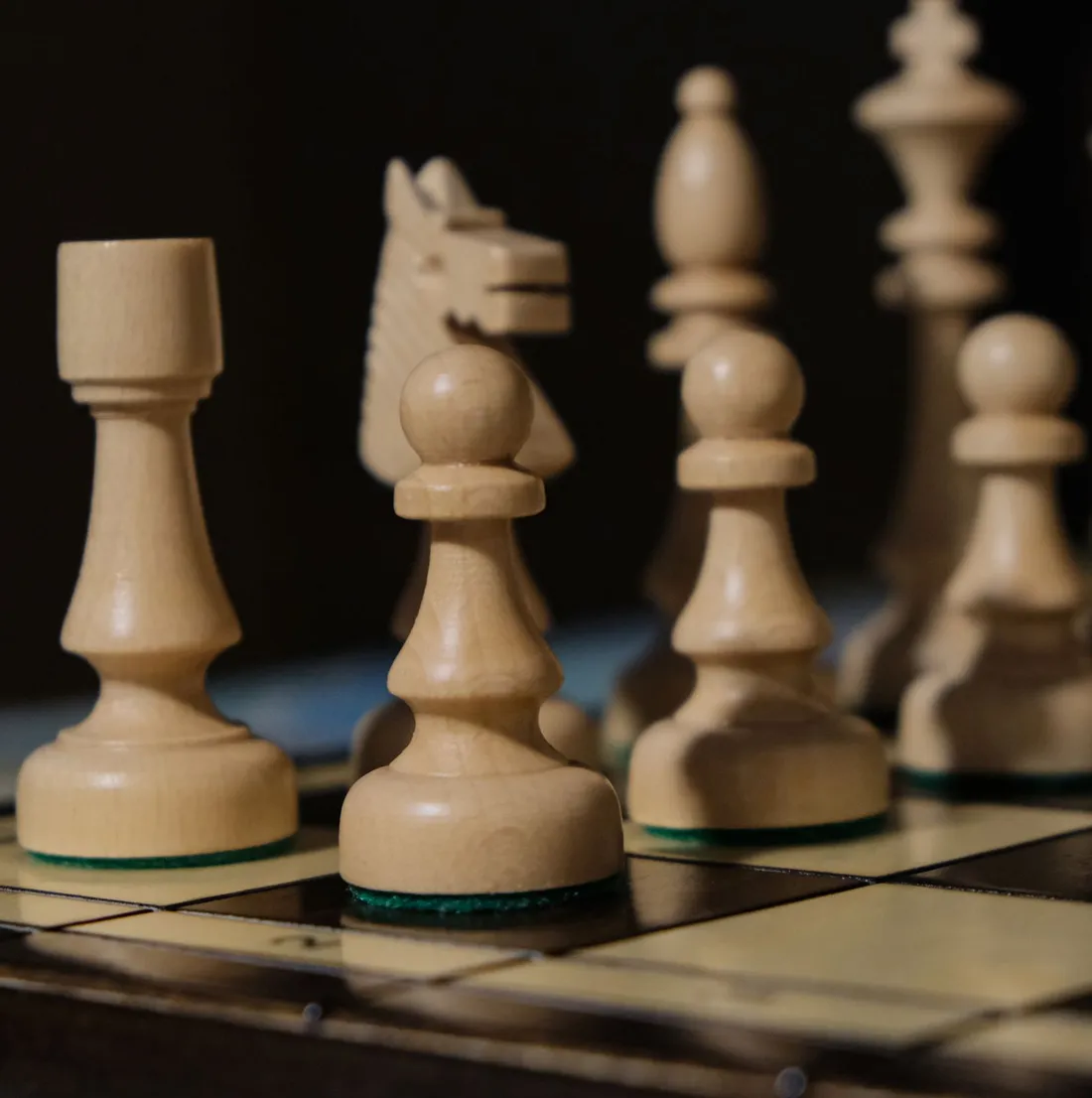 Close-up of pieces arranged on a chess board