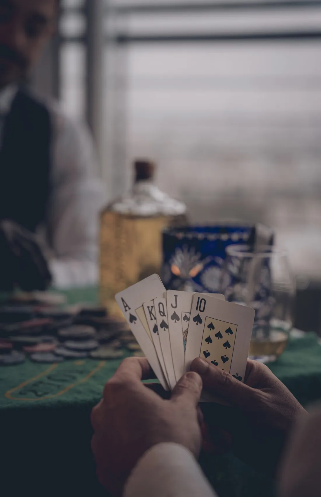 A man playing cards at a table
