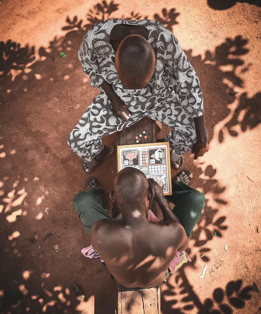 Top view photo of men playing a board game