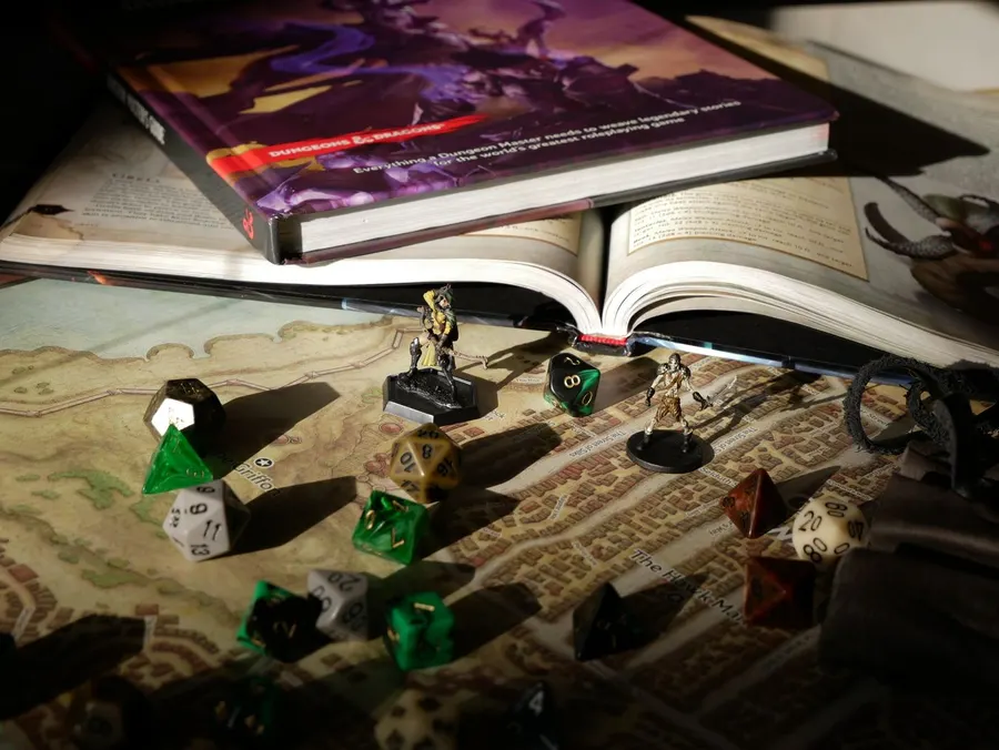 Figurines and dice on a board game map
