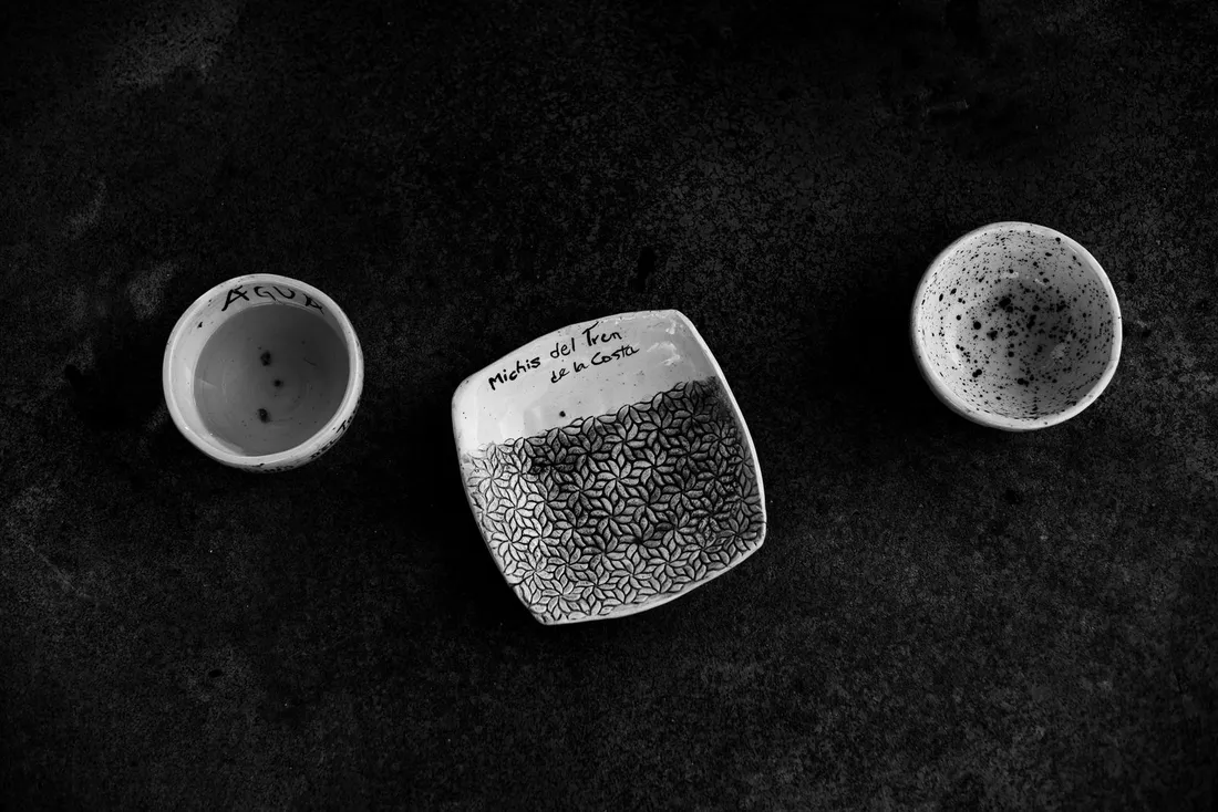 Black and white ceramic bowls on a textured surface