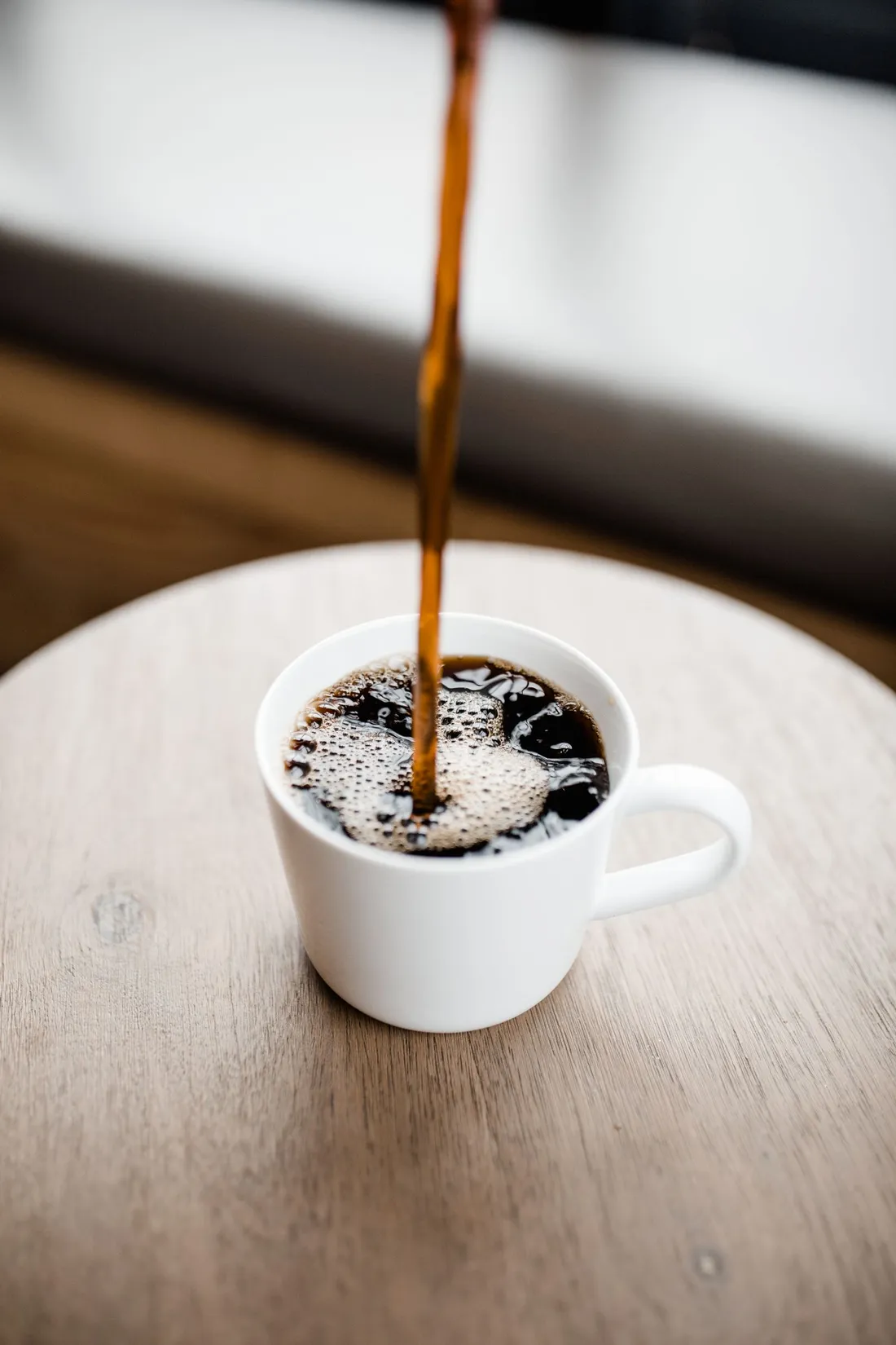 A white ceramic mug with coffee