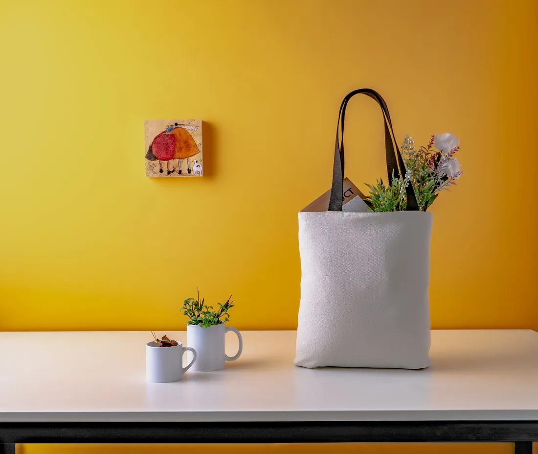 Two white ceramic mugs on a wooden table