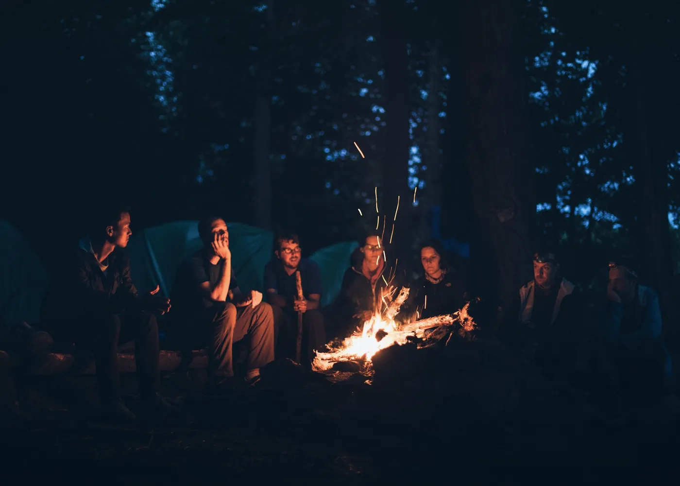 A circle of fire embers at night
