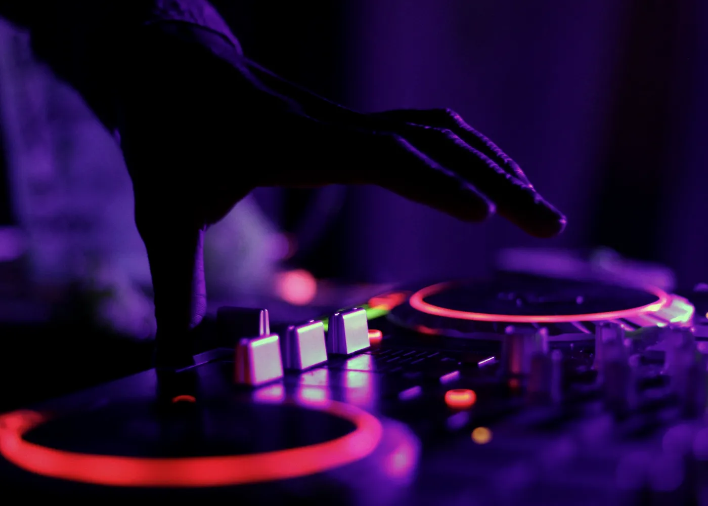 DJ console under blue and warm light