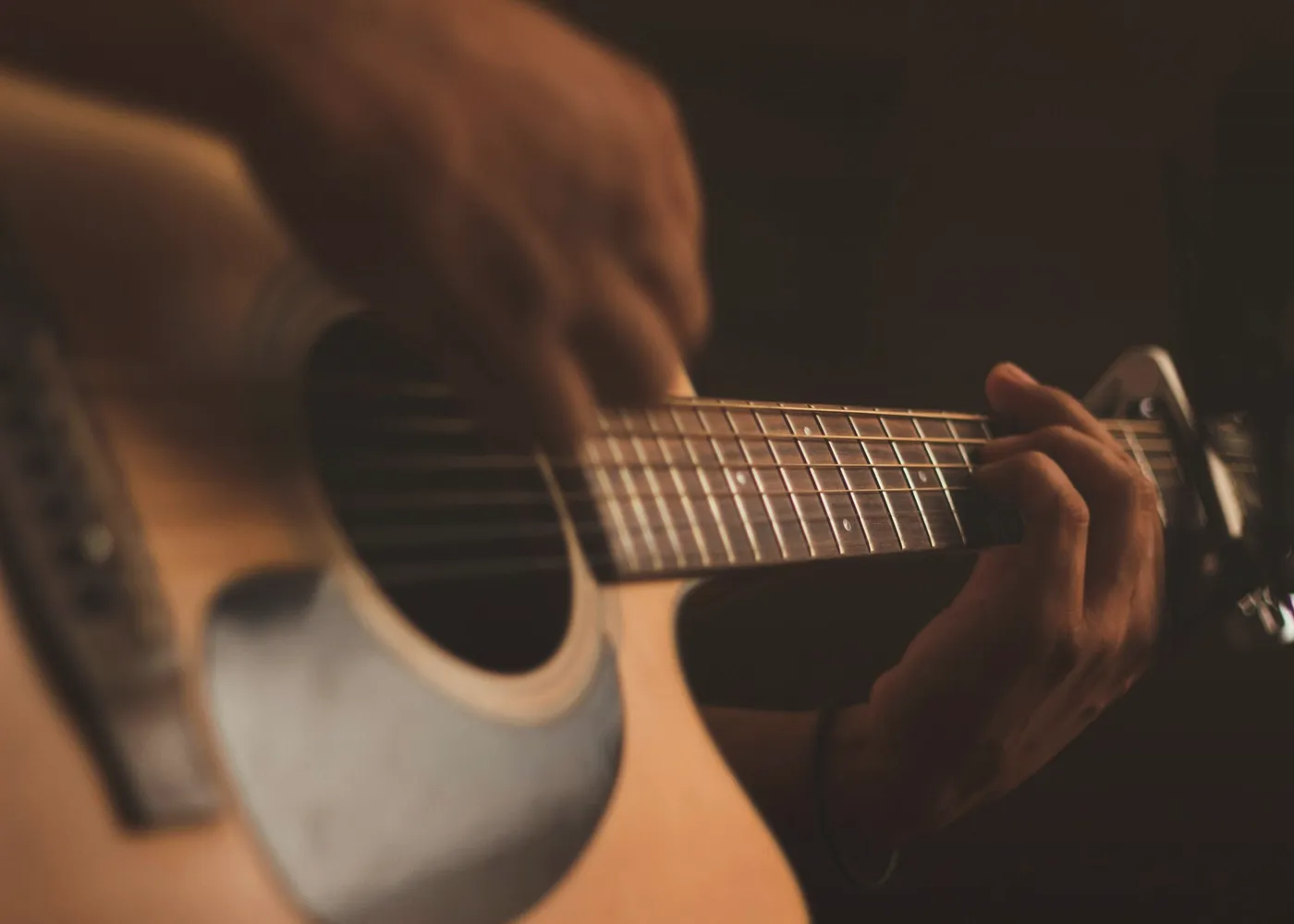Guitar during an acoustic set in low light