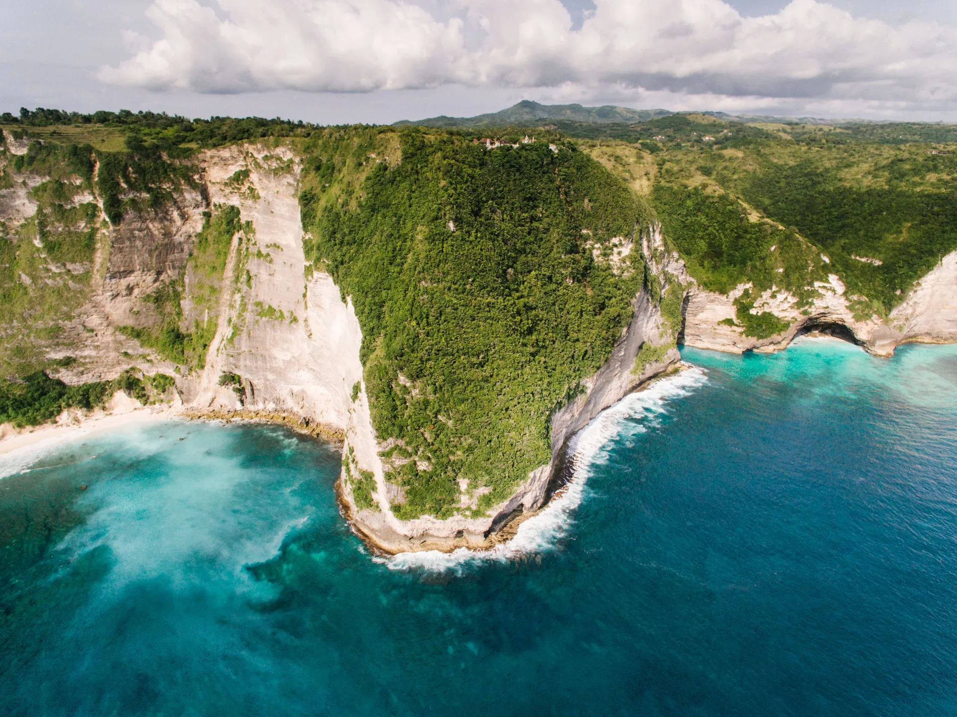 Aerial view of the cliffside coastline approaching MIRADOR's headland