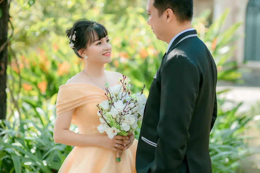 A woman holding a bouquet of flowers