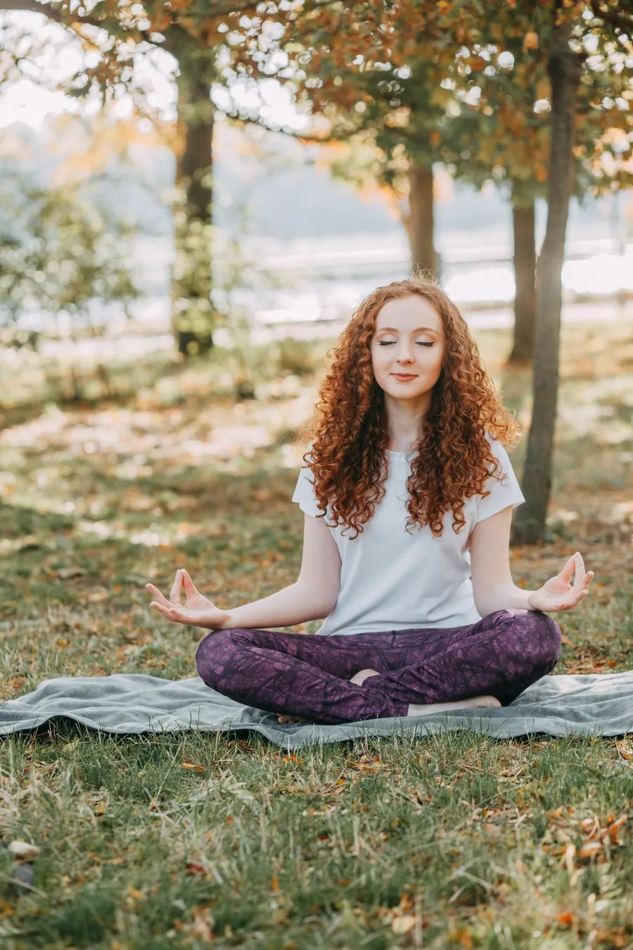 A woman meditating with her eyes closed