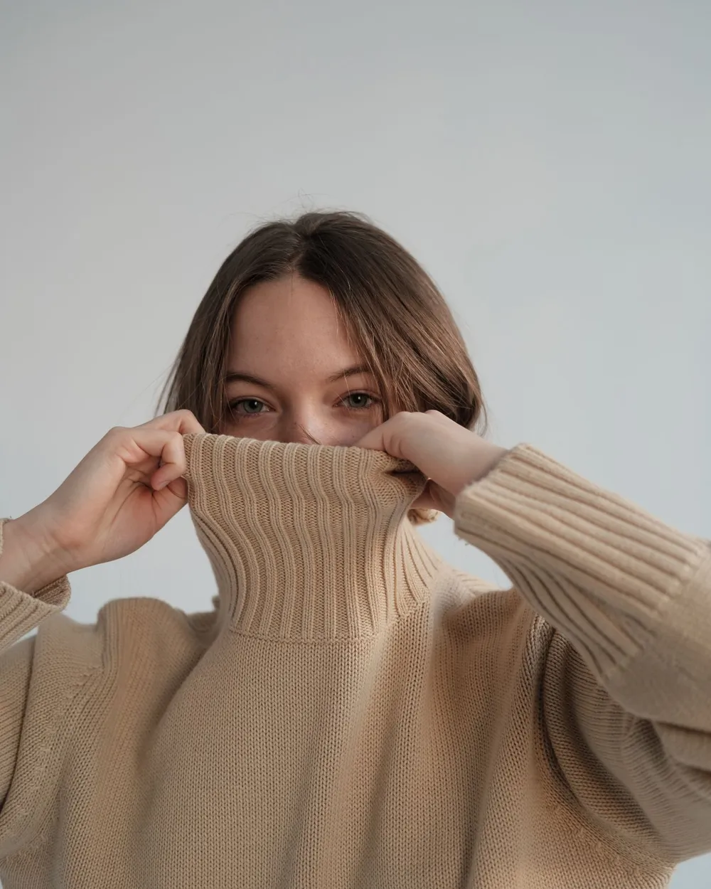 Sand Roll Neck — Fine merino, high collar