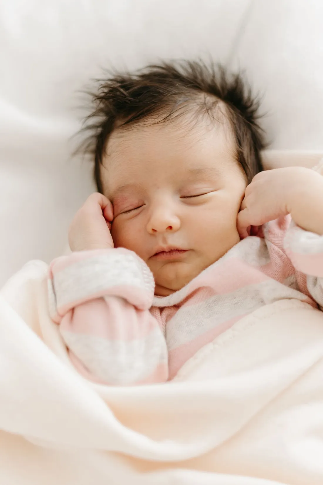 A sleeping newborn resting quietly