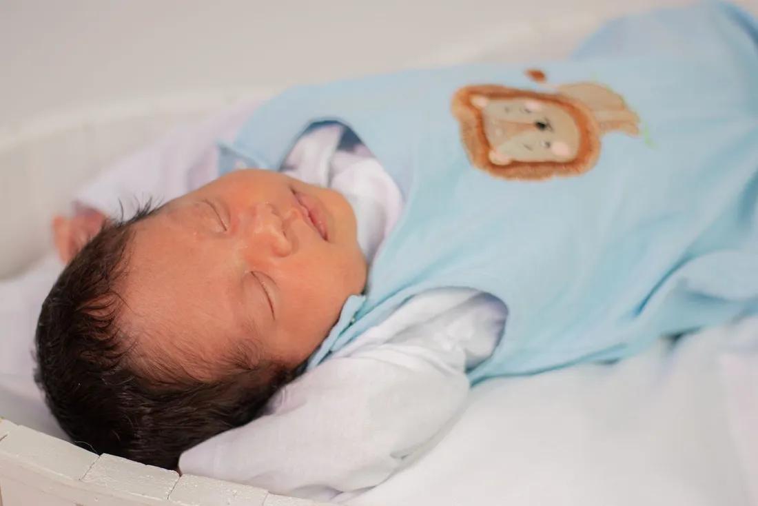 A newborn baby sleeping peacefully