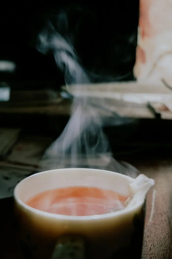 Steam rising from a hot cup of tea