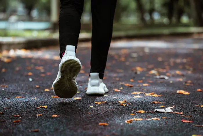 A jogger running through an empty park