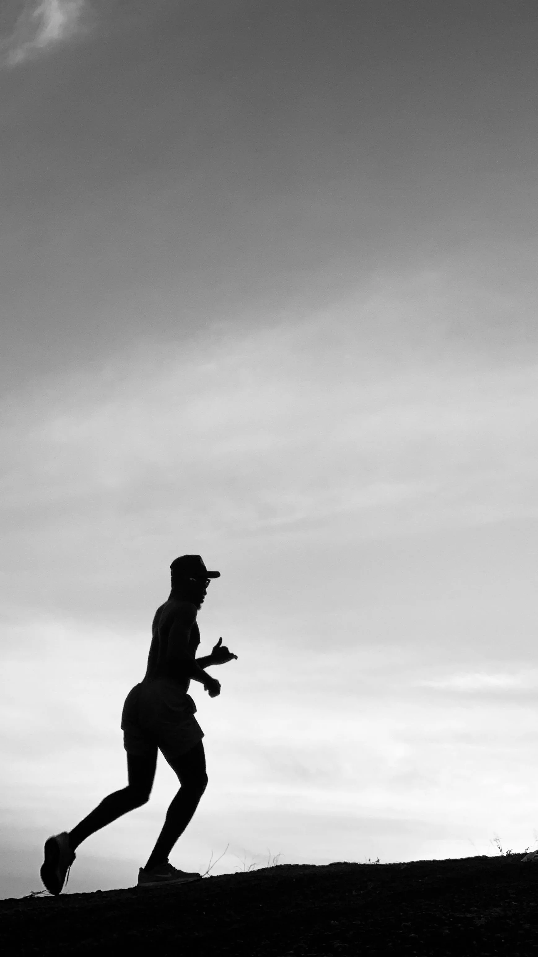Silhouette of a runner at dusk