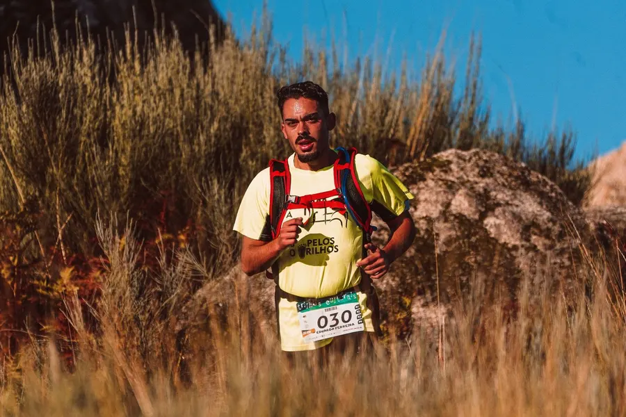 A runner crossing an open field