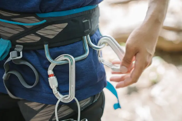 Close-up of a climber wearing harness and rope gear