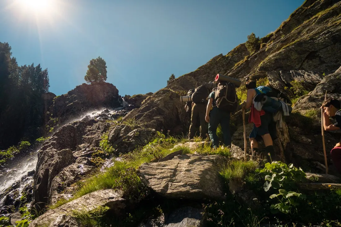 Backpackers hiking together in the mountains