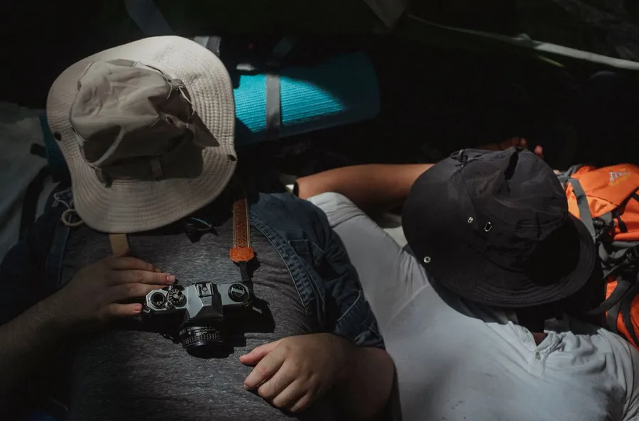 Campers sleeping inside a tent