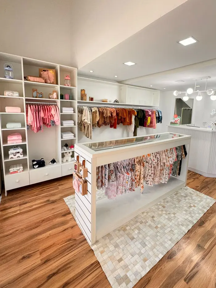 A bright children's clothing boutique with colorful racks