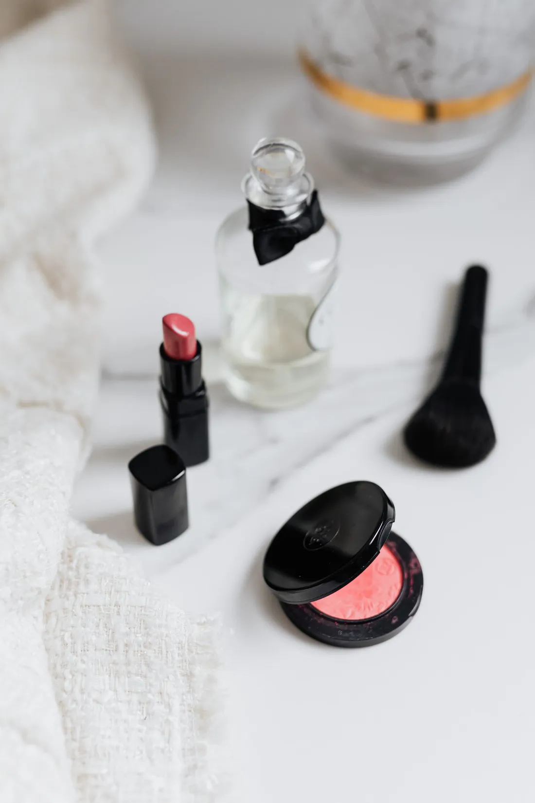Flat lay of beauty products on a marble surface
