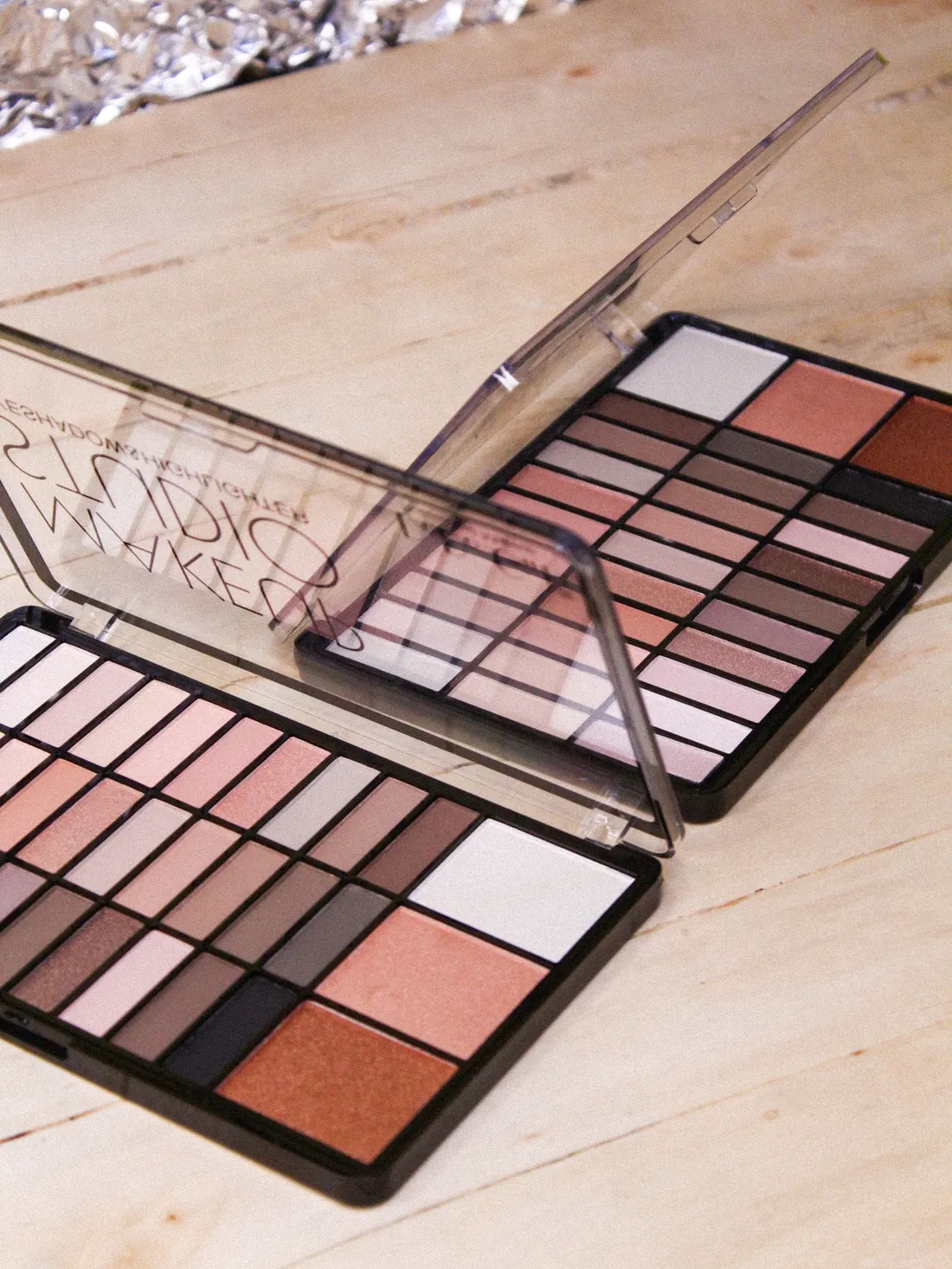 Close-up of an eyeshadow palette with warm nude shades