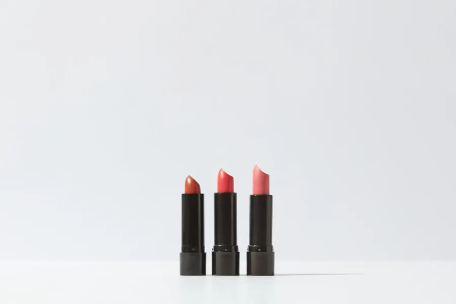 Three lipsticks displayed on a white background