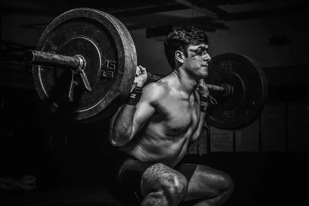 A lifter at the bottom of a heavily loaded back squat