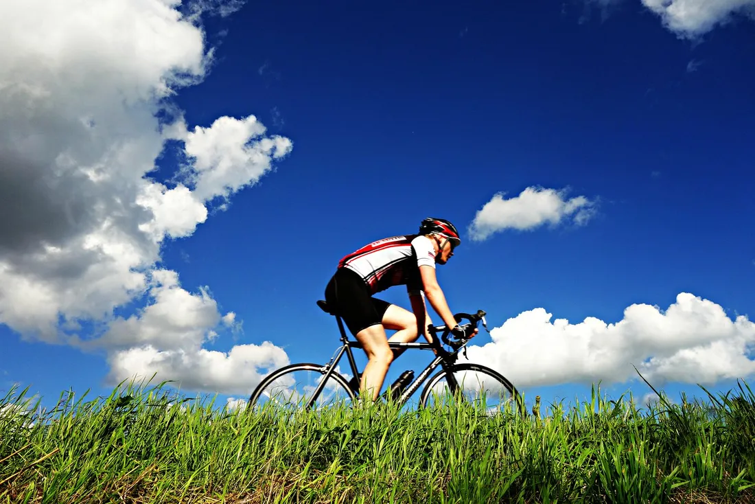 Cyclist riding a road bike on open tarmac