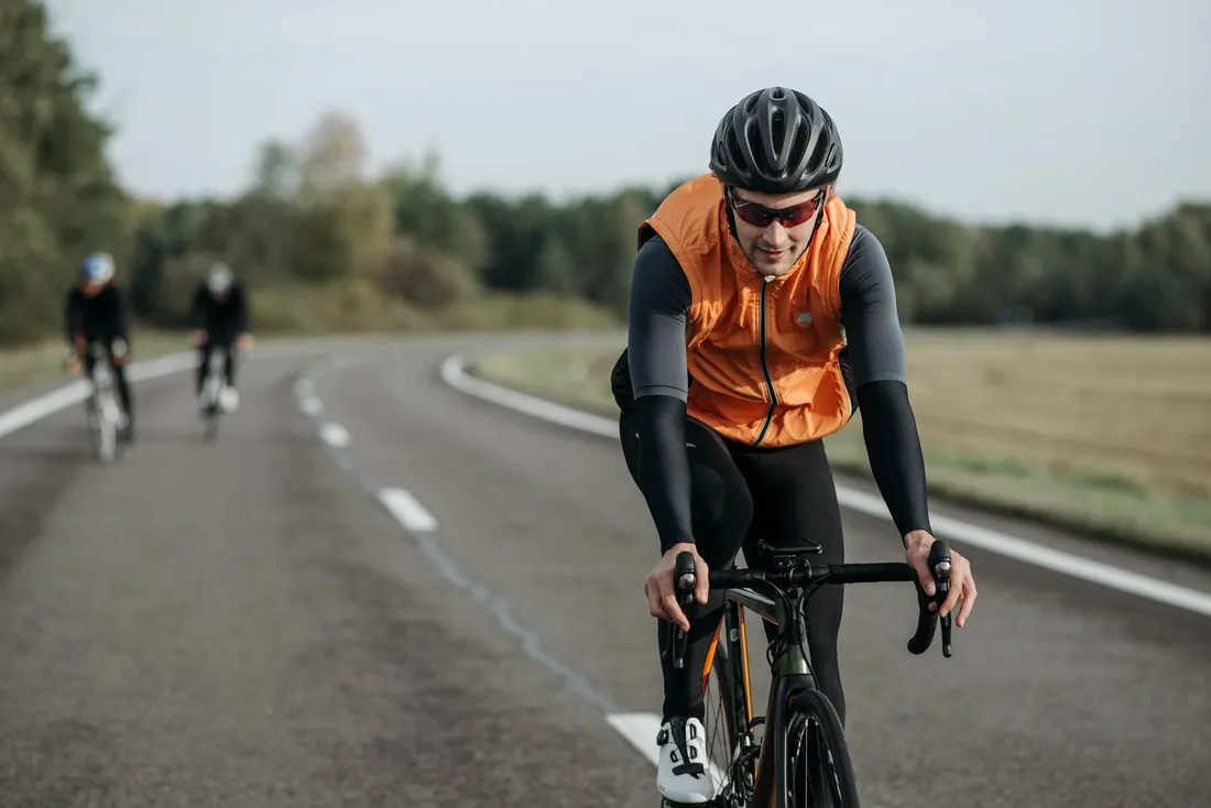 Close-up of a cyclist riding a bike on the road