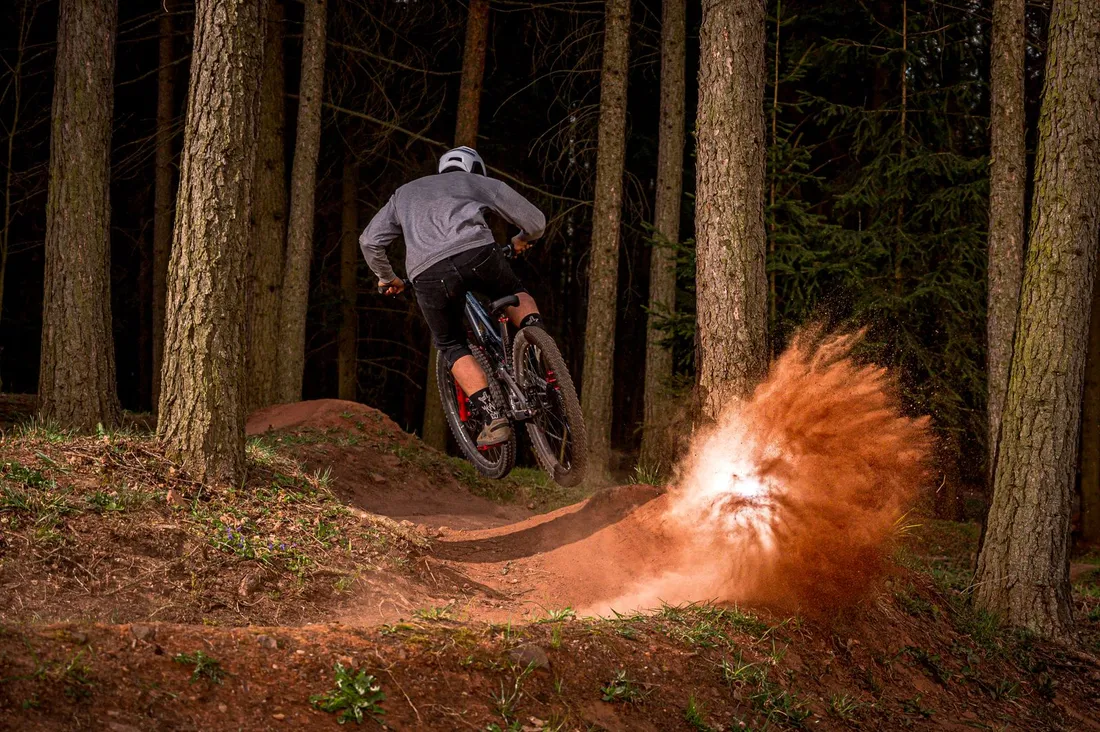 Cyclist riding a bike on a dirt road
