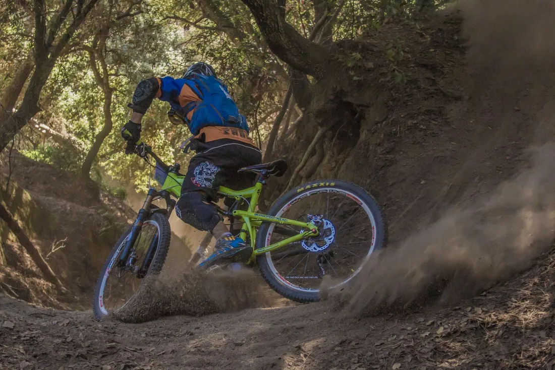 Cyclist in a riding jacket with an off-road bike