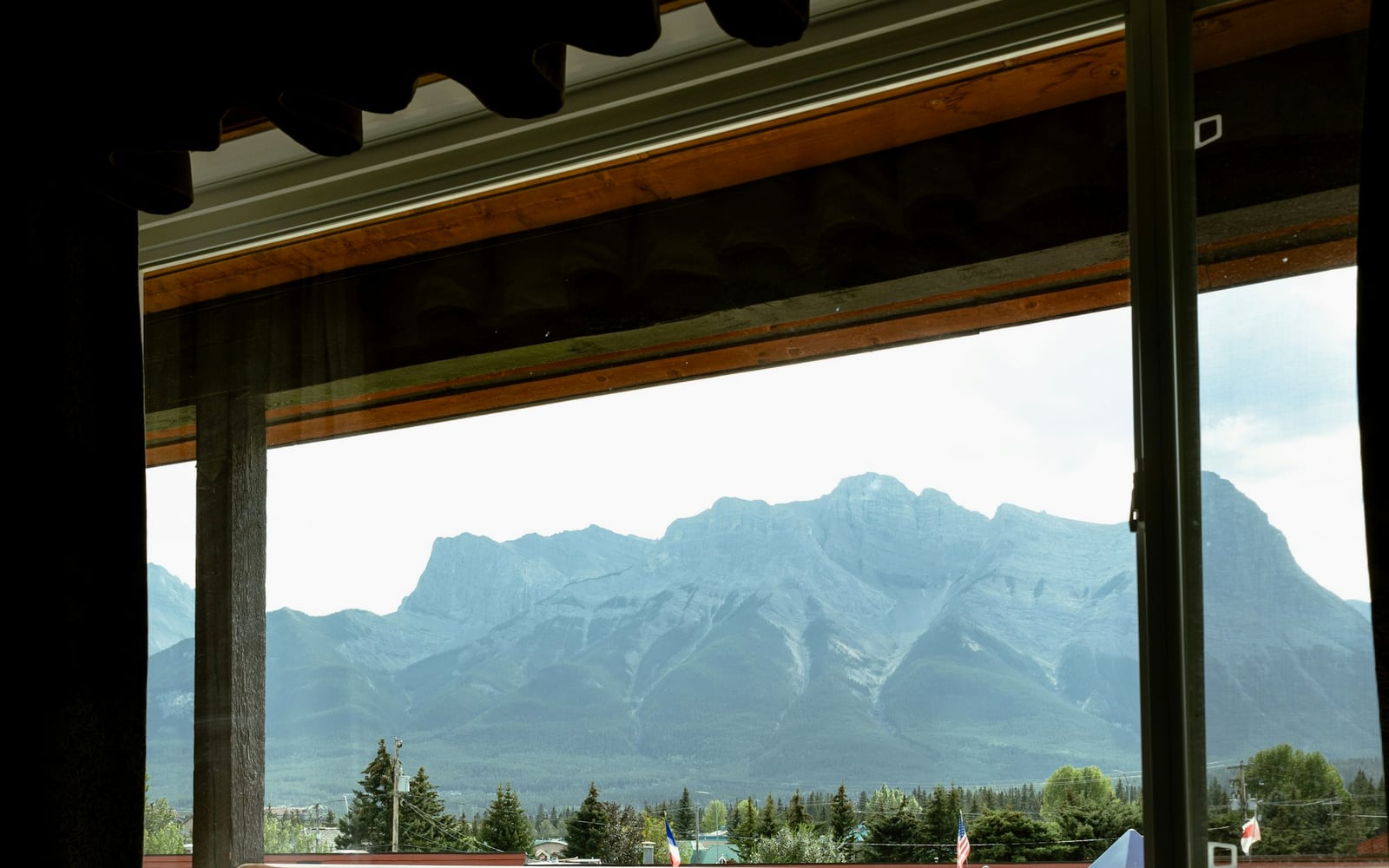 View from the Valley Double: a wide window over the village lights and valley floor at dusk
