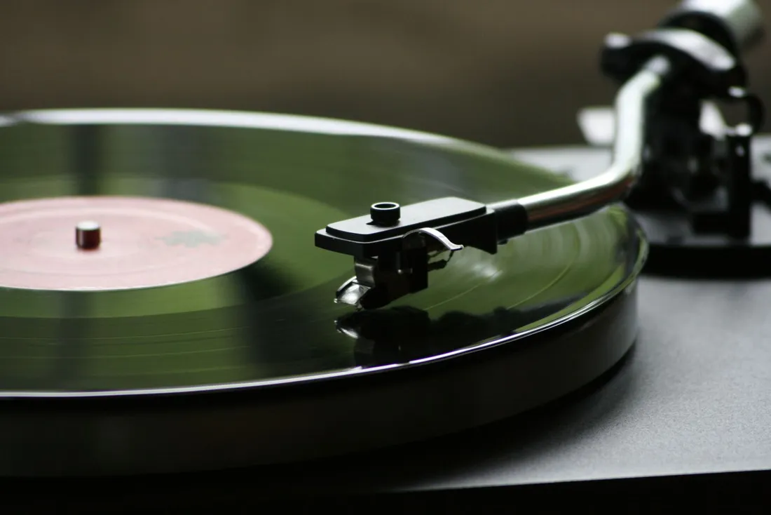 Close-up of a vinyl record playing on a turntable